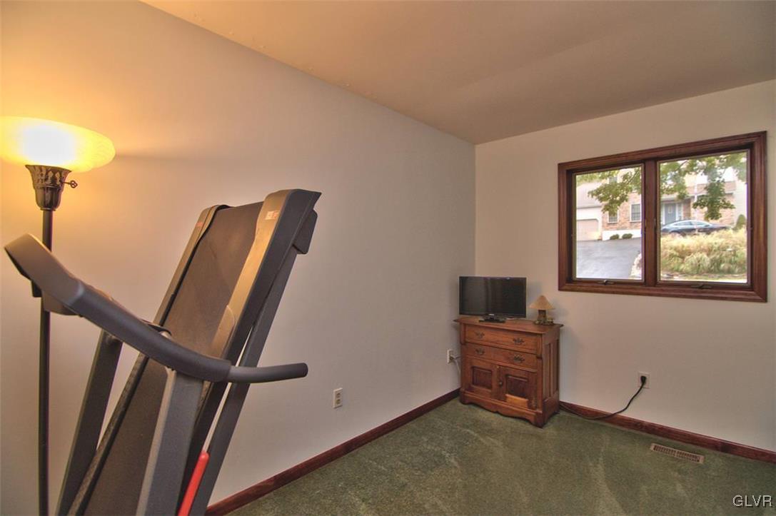 4280 Pne Rdg Drive Bushkill, PA 18324 - Photo 25 of 32 a view of an empty room with furniture window and hardwood floor
