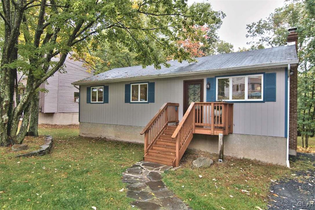 4280 Pne Rdg Drive Bushkill, PA 18324 - Photo 3 of 32 a backyard of a house with seating space
