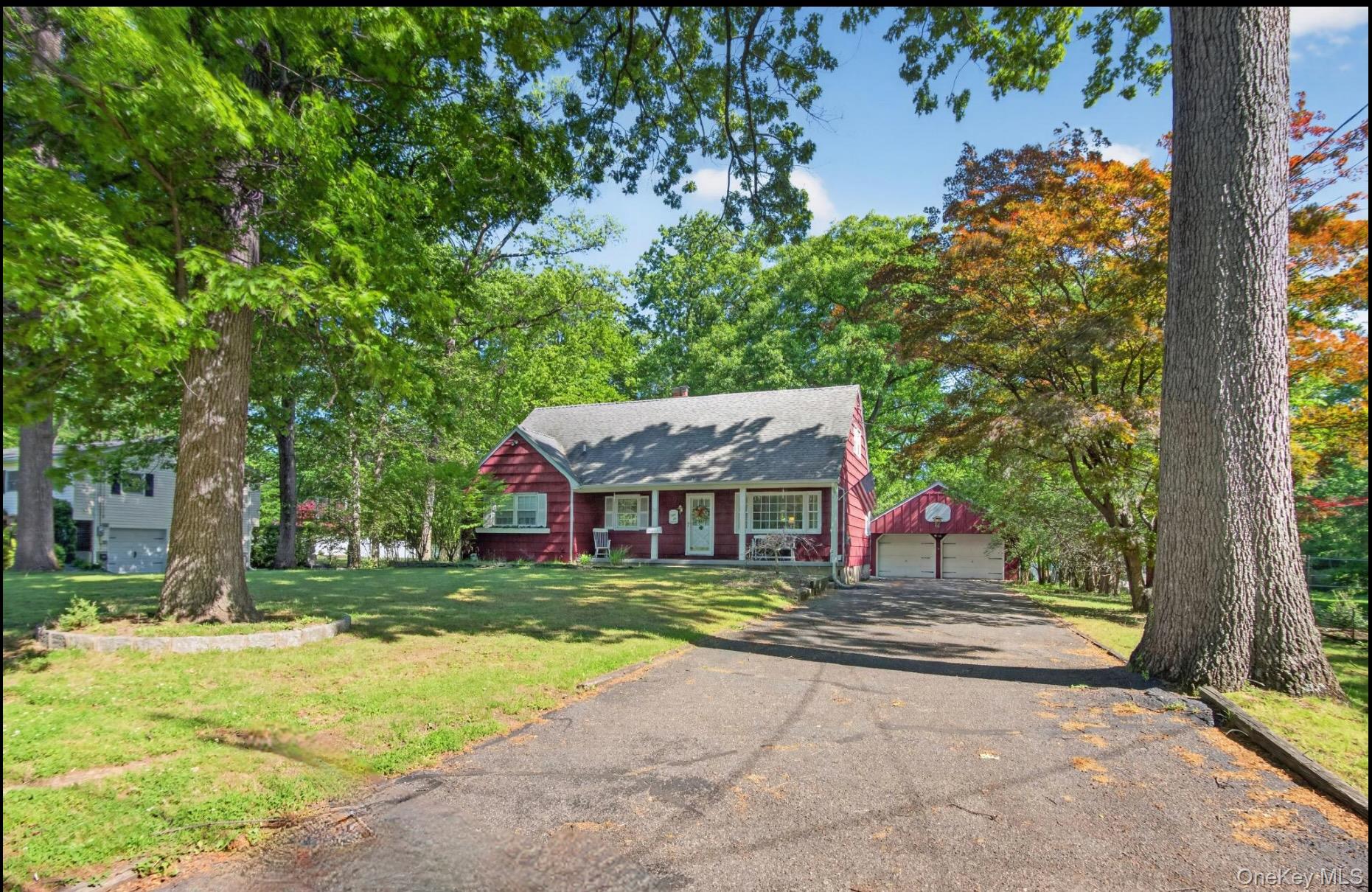 56 Oak Road New City, NY 10956 - Photo 1 of 30 a house that has a tree in front of it