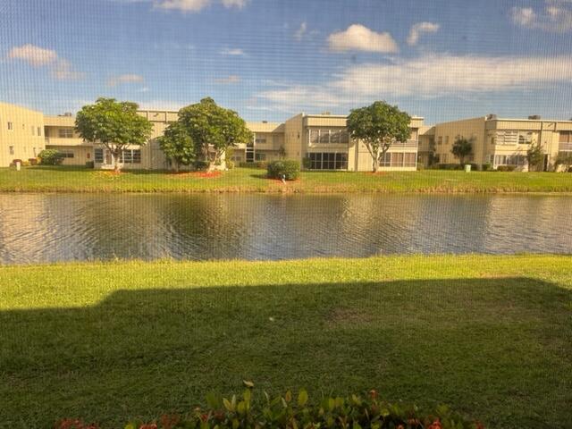 348 Monaco H Delray Beach, Unit 348 Delray Beach, FL 33446 - Photo 16 of 41 a view of a swimming pool with an ocean view