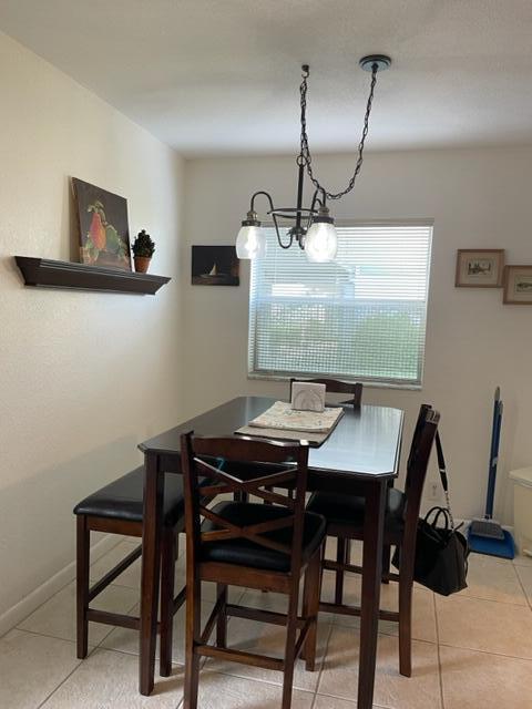348 Monaco H Delray Beach, Unit 348 Delray Beach, FL 33446 - Photo 4 of 41 a view of a dining table and chairs