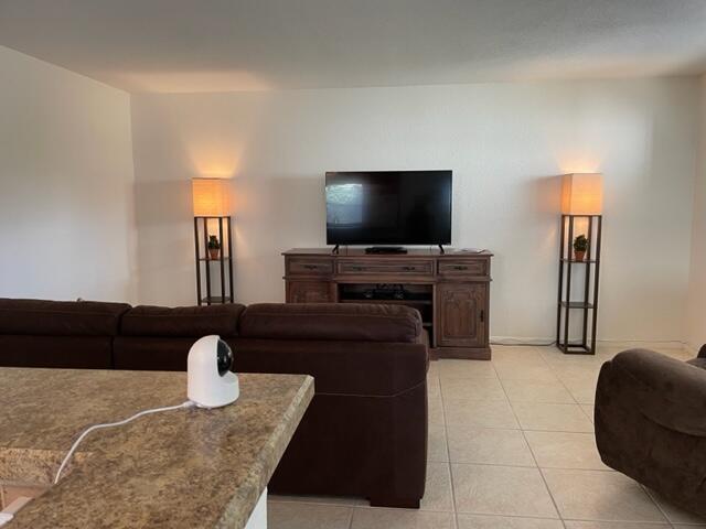 348 Monaco H Delray Beach, Unit 348 Delray Beach, FL 33446 - Photo 6 of 41 a living room with furniture and a flat screen tv