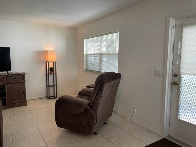 348 Monaco H Delray Beach, Unit 348 Delray Beach, FL 33446 - Photo 8 of 41 a living room with furniture and a window