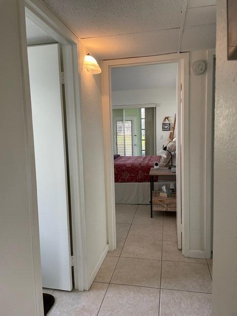 348 Monaco H Delray Beach, Unit 348 Delray Beach, FL 33446 - Photo 9 of 41 a bedroom with a bed and a mirror