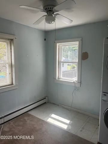 a view of a hallway with washer and dryer