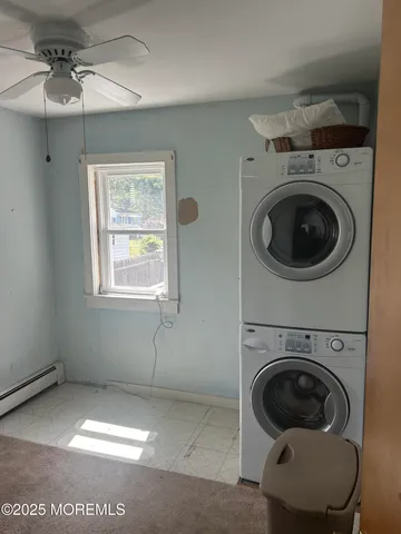a view of entryway and kitchen