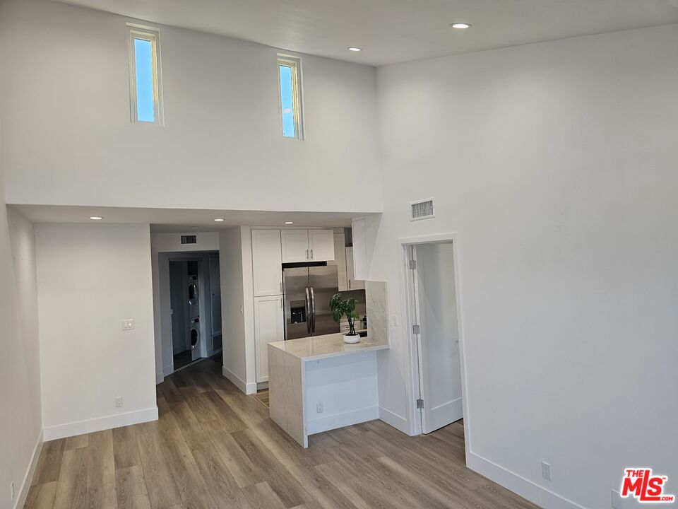 11675 Darlington Avenue, Unit 301 Los Angeles, CA 90049 - Photo 4 of 16 a room with storage and utility