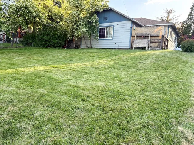 a backyard of a house with lots of green space