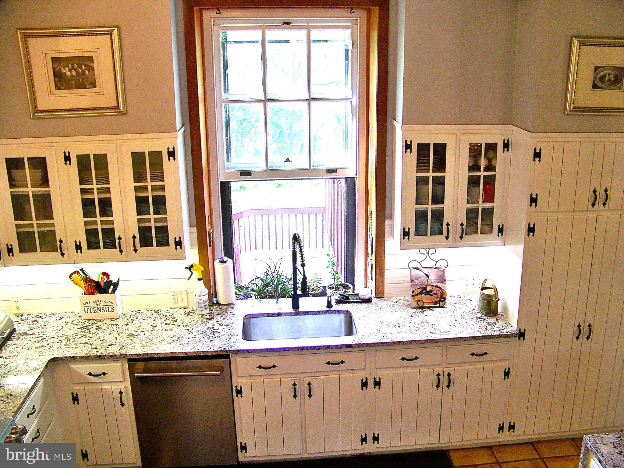 335 Bent Road Wyncote, PA 19095 - Photo 23 of 45 a bathroom with granite countertop a sink and a window