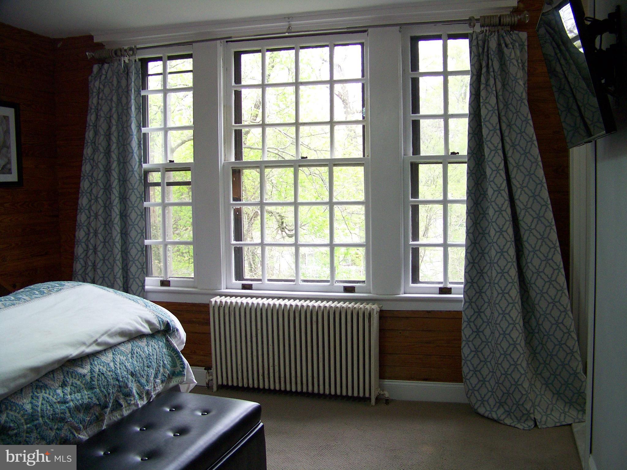 335 Bent Road Wyncote, PA 19095 - Photo 31 of 45 a bedroom with a bed and a window