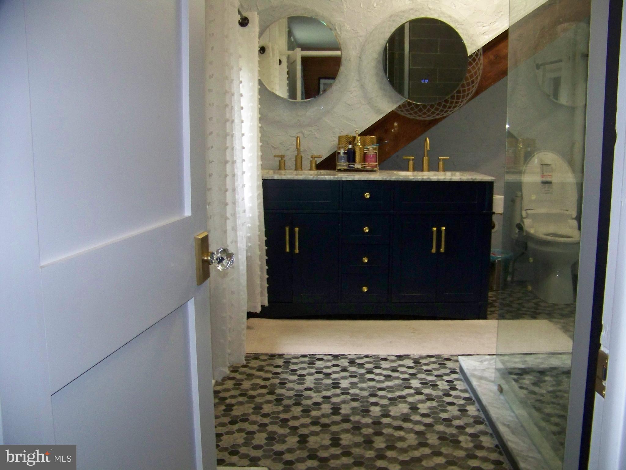 335 Bent Road Wyncote, PA 19095 - Photo 33 of 45 a bathroom with a sink and a mirror