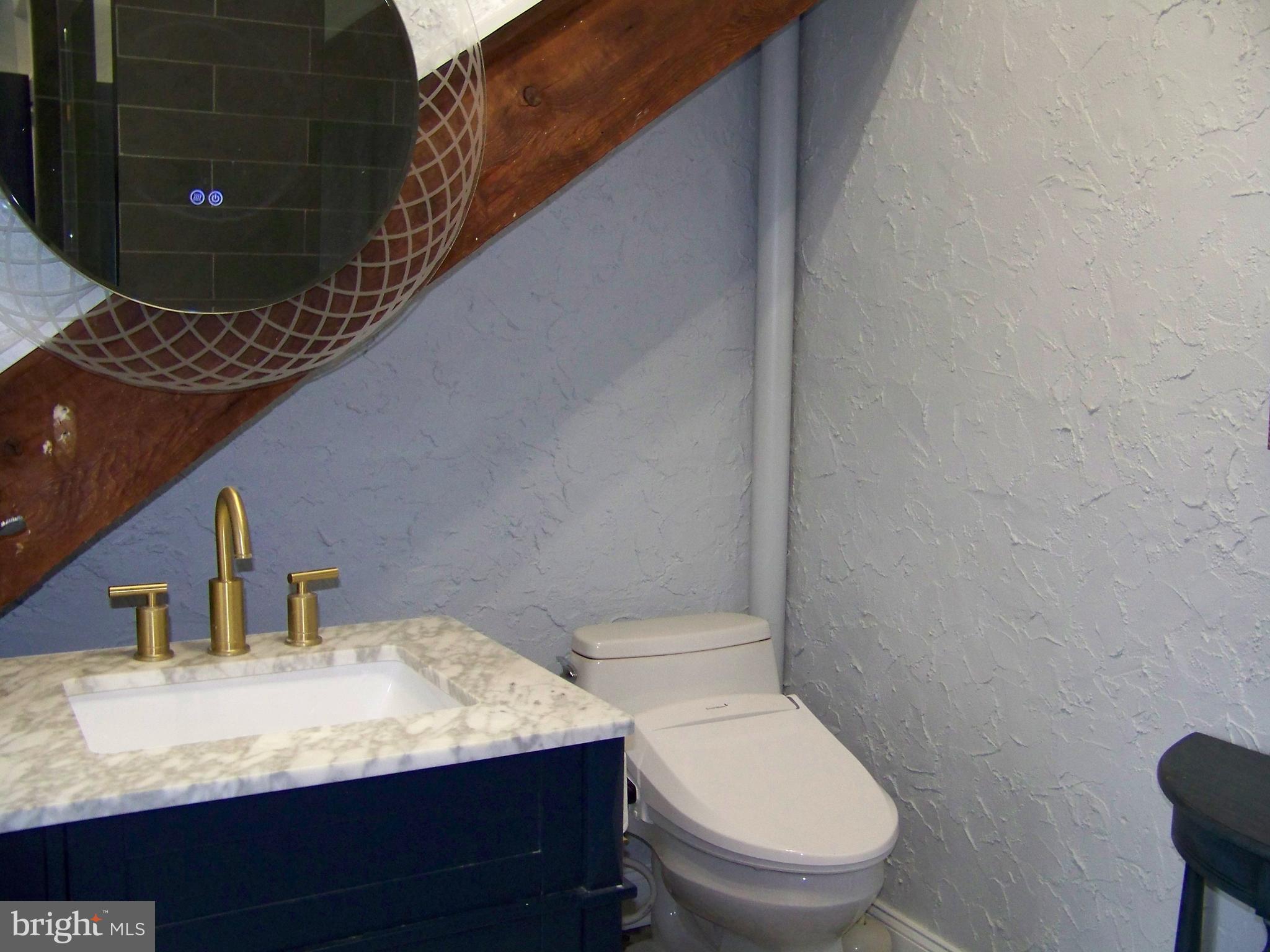 335 Bent Road Wyncote, PA 19095 - Photo 35 of 45 a bathroom with a toilet sink and mirror