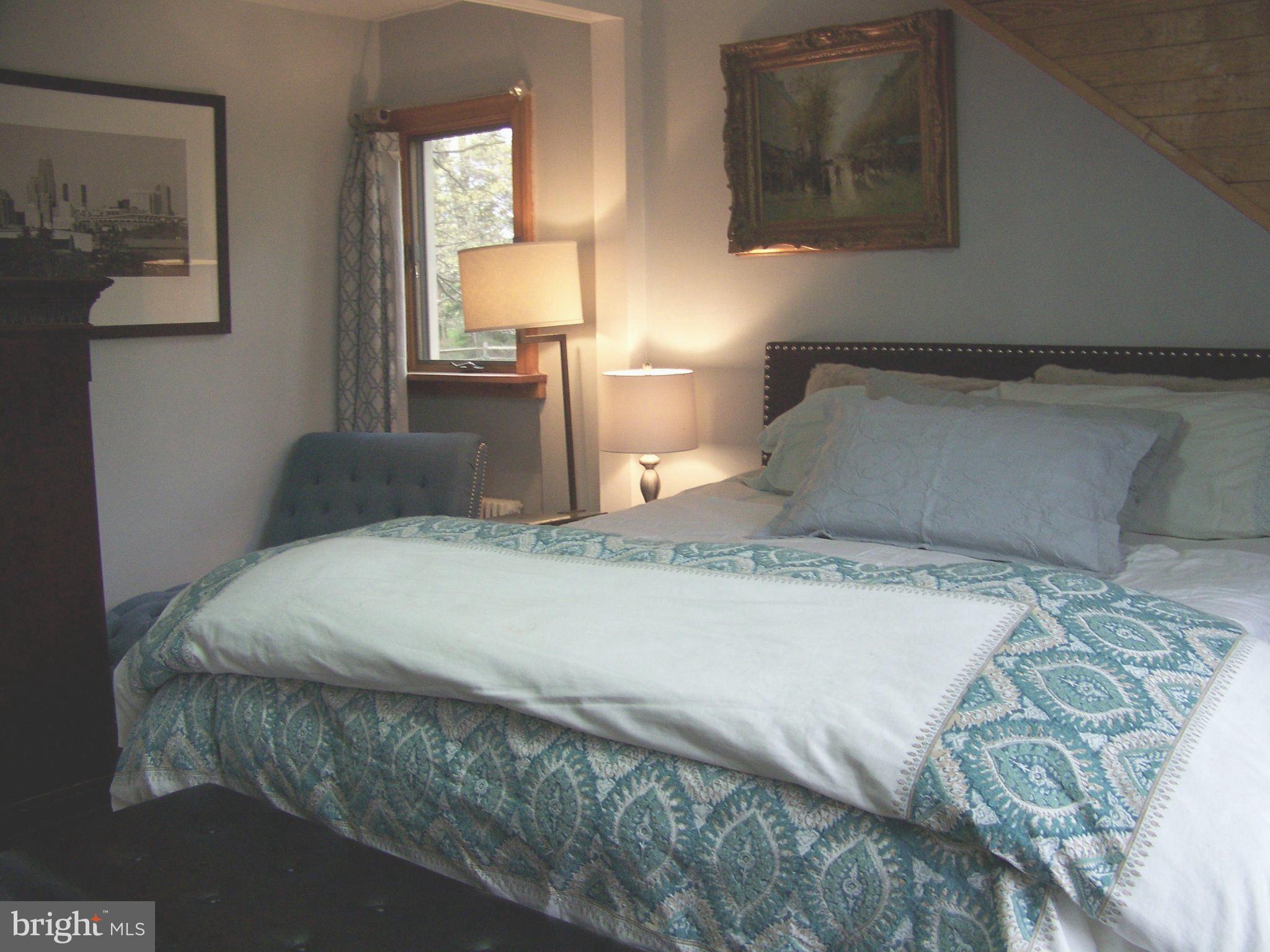 335 Bent Road Wyncote, PA 19095 - Photo 39 of 45 a bedroom with a bed and painting on the wall