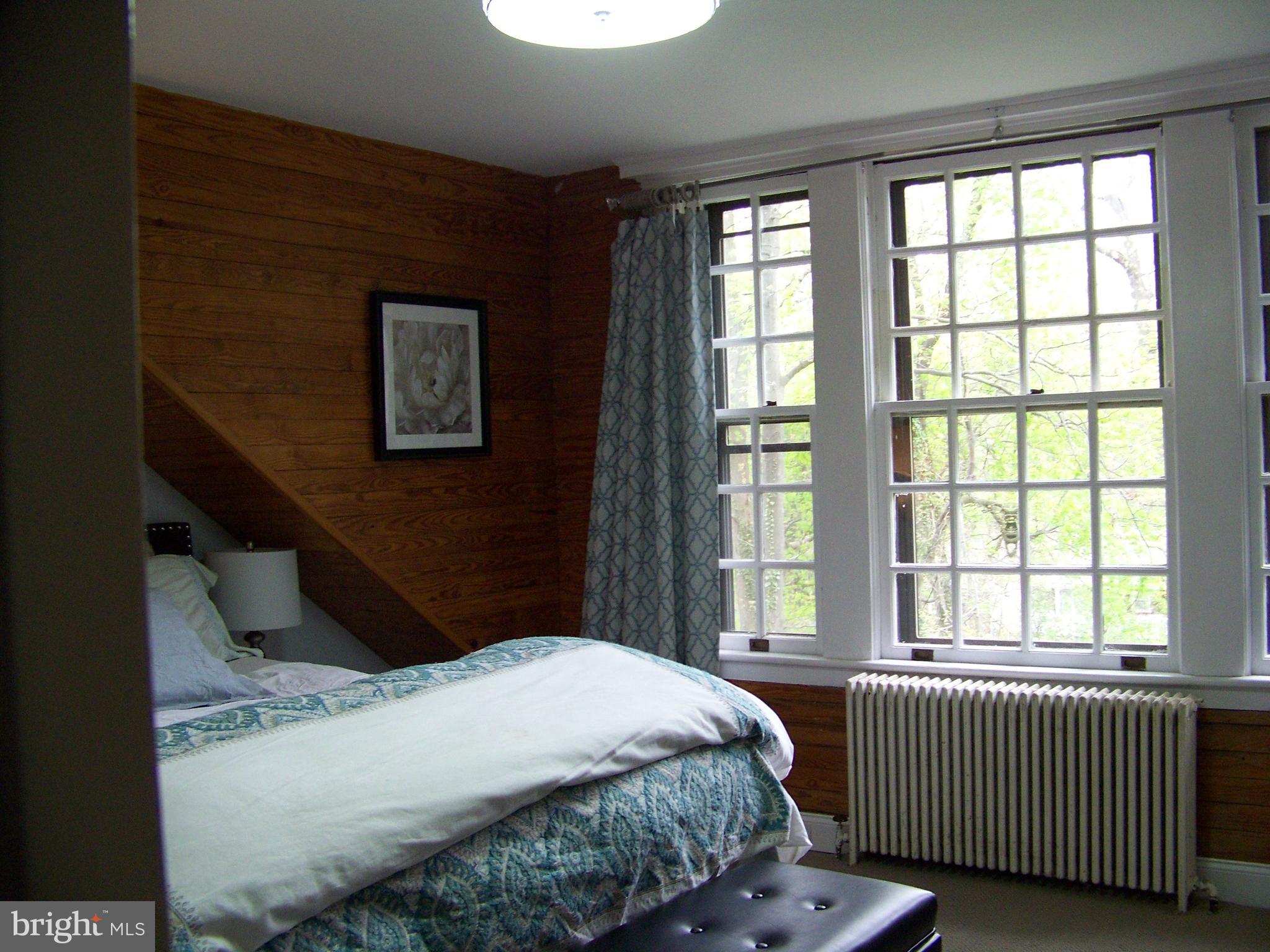 335 Bent Road Wyncote, PA 19095 - Photo 40 of 45 a bedroom with a bed and a window