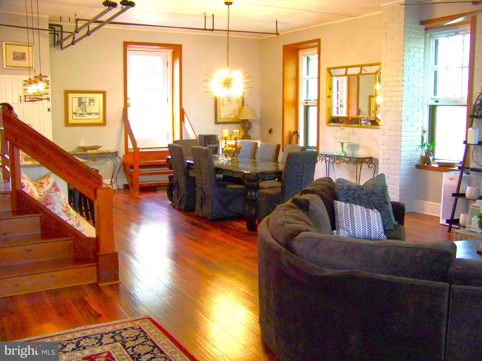 335 Bent Road Wyncote, PA 19095 - Photo 4 of 45 a living room with couches bookshelf and a large window