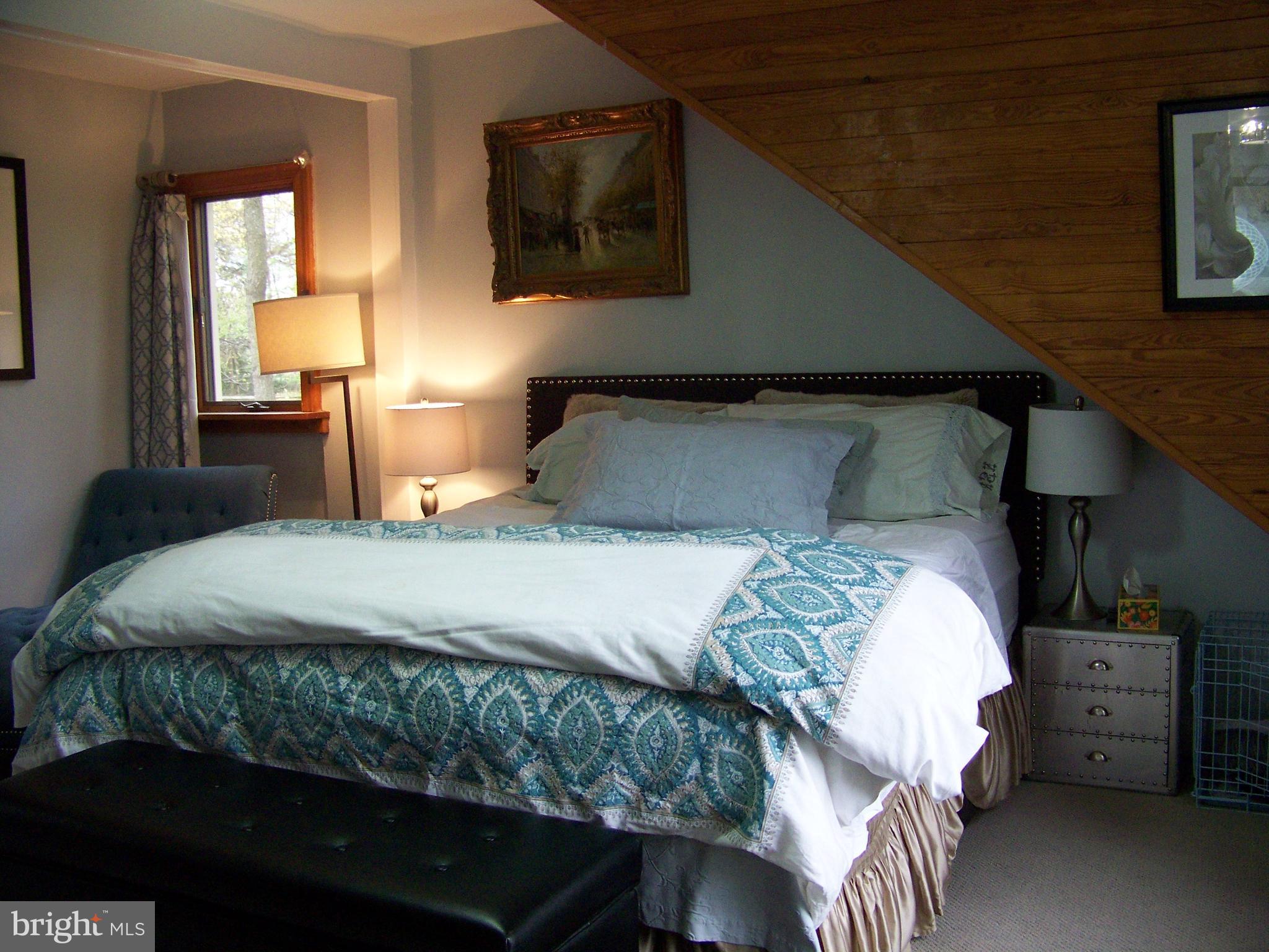 335 Bent Road Wyncote, PA 19095 - Photo 41 of 45 a bedroom with a bed and a tv on the dresser