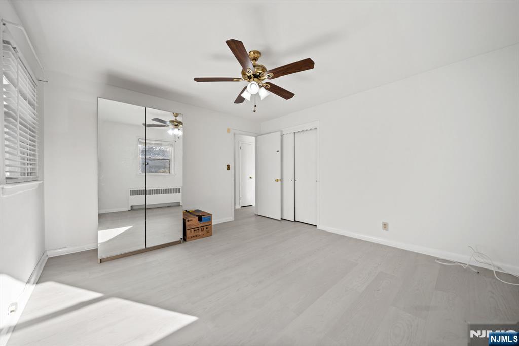 23 Arn Terrace, Unit 1 Secaucus, NJ 07094 - Photo 14 of 22 a view of an empty room with a ceiling fan