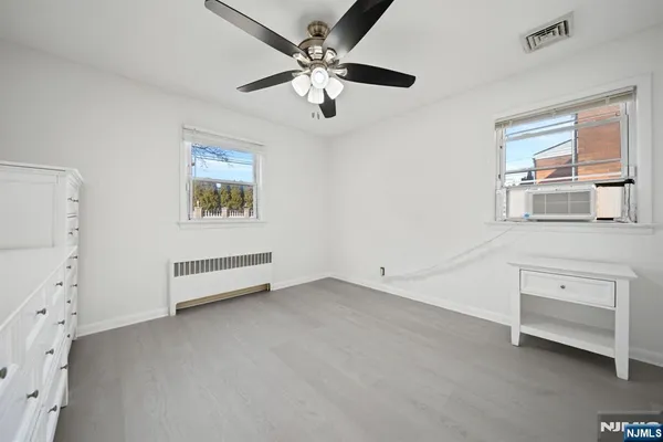 a view of workspace with chandelier fan