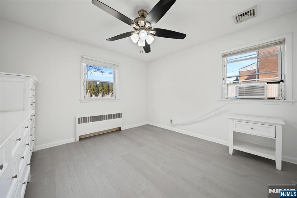 23 Arn Terrace, Unit 1 Secaucus, NJ 07094 - Photo 16 of 22 a view of workspace with chandelier fan