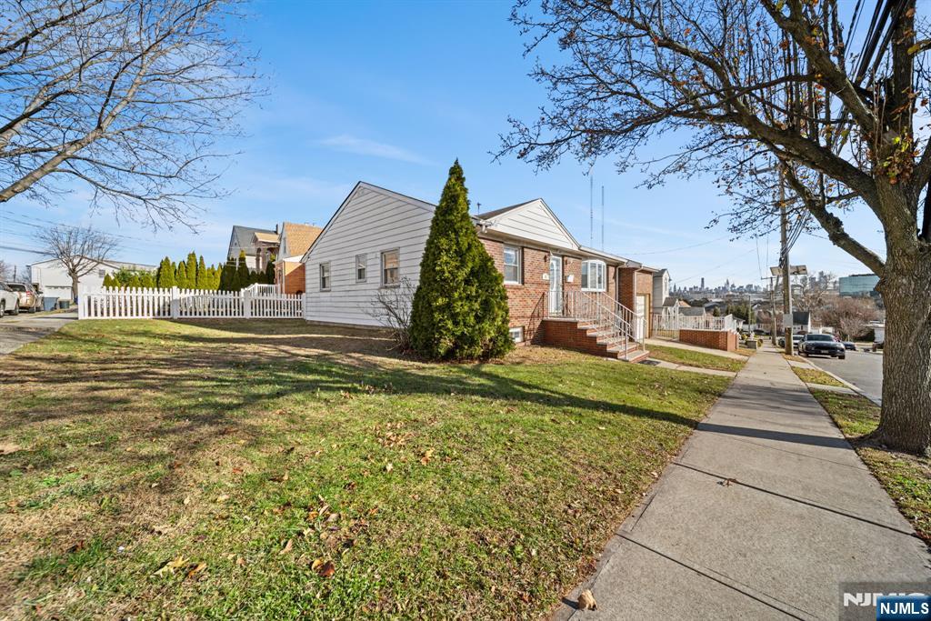 23 Arn Terrace, Unit 1 Secaucus, NJ 07094 - Photo 21 of 22 a front view of a house with a yard