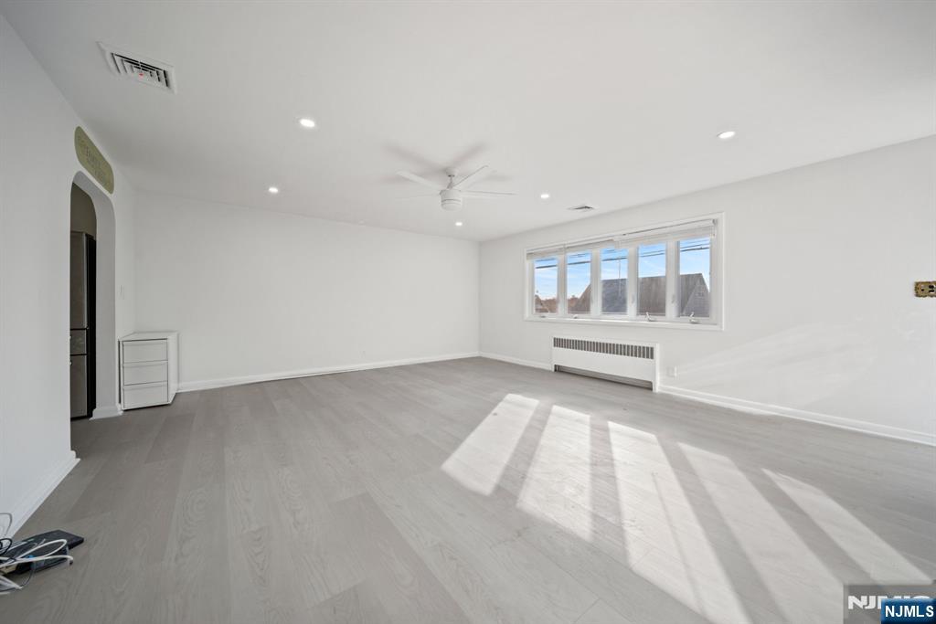23 Arn Terrace, Unit 1 Secaucus, NJ 07094 - Photo 3 of 22 wooden floor in an empty room with a window