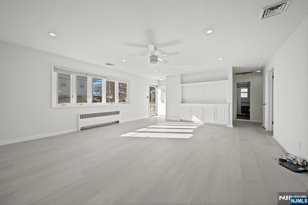 23 Arn Terrace, Unit 1 Secaucus, NJ 07094 - Photo 5 of 22 a view of livingroom with hardwood floor and ceiling fan
