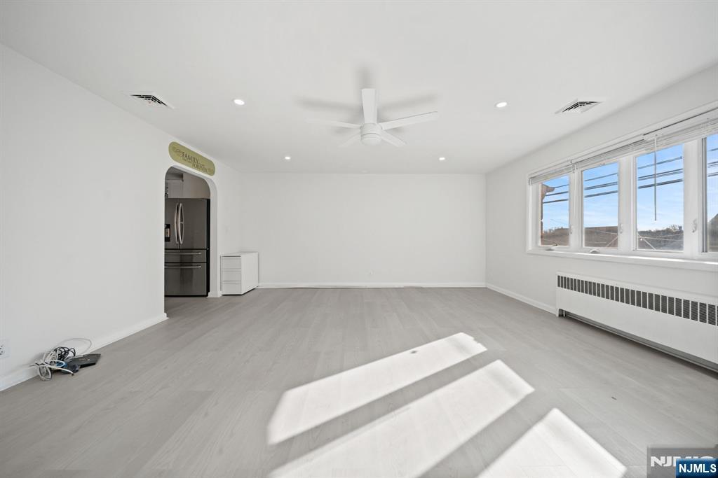 23 Arn Terrace, Unit 1 Secaucus, NJ 07094 - Photo 7 of 22 wooden floor in an empty room with a window