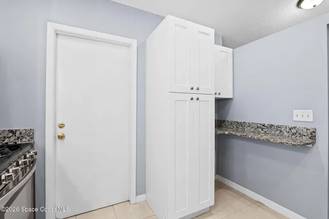 a view of cabinets and window