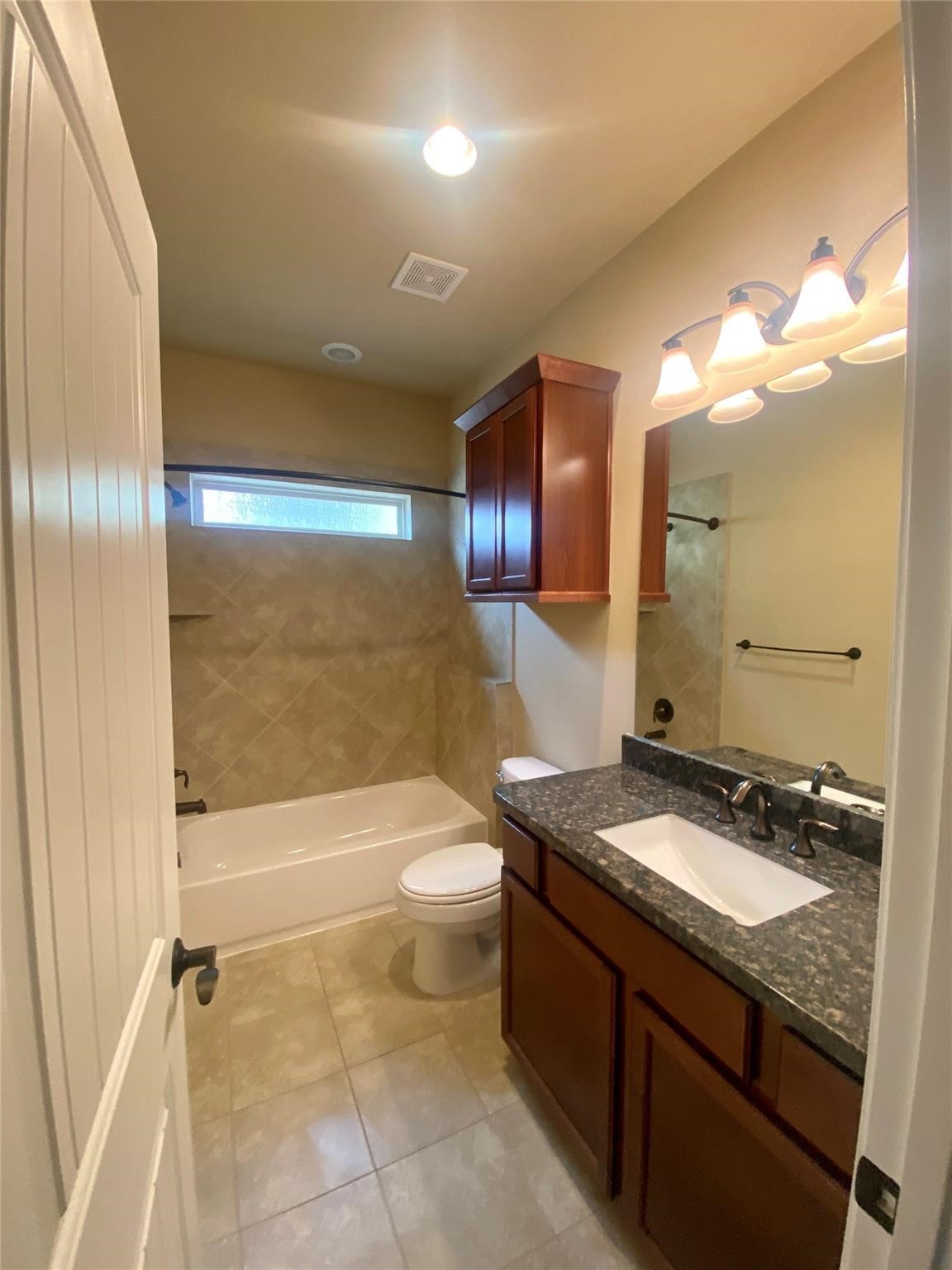 1306 Dian Street Houston, TX 77008 - Photo 11 of 17 a bathroom with a granite countertop sink toilet and shower