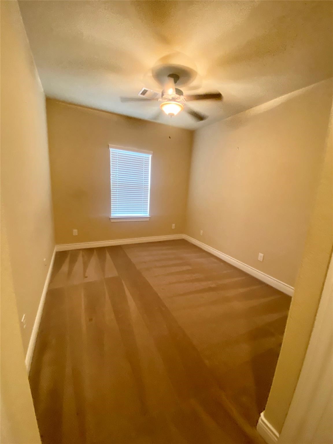 1306 Dian Street Houston, TX 77008 - Photo 10 of 17 an empty room with a wooden floor and entryway