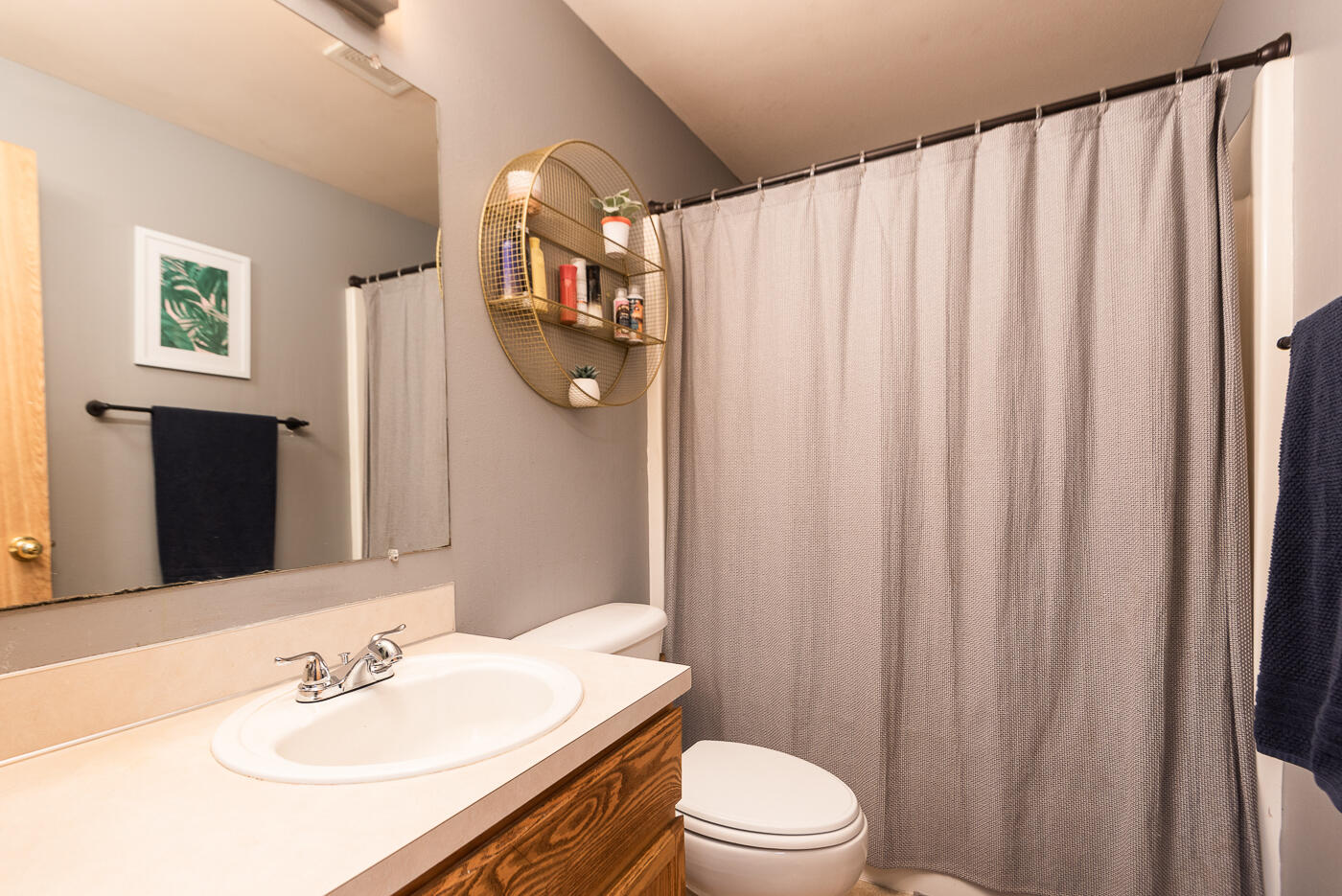17270 Gadwall Road Bend, OR 97707 - Photo 18 of 30 a bathroom with a sink a toilet and shower curtain