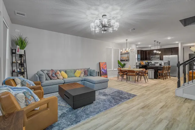 a bedroom with a bed and a television