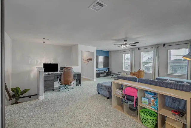 a bedroom with a bed and a television