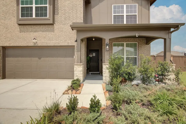a large kitchen with a table and chairs