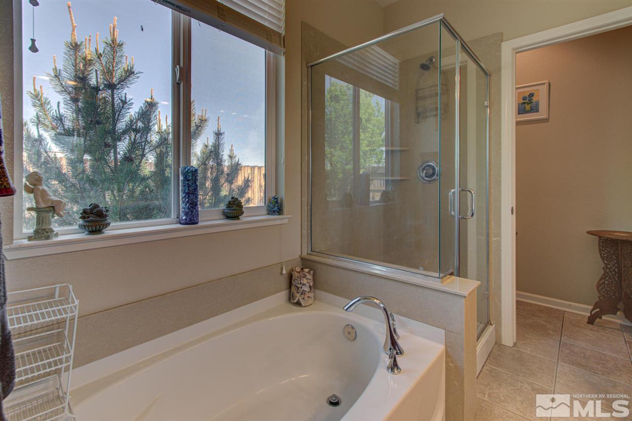 9045 Convair Way Reno, NV 89506 - Photo 28 of 34 a bathroom with a bathtub and a shower