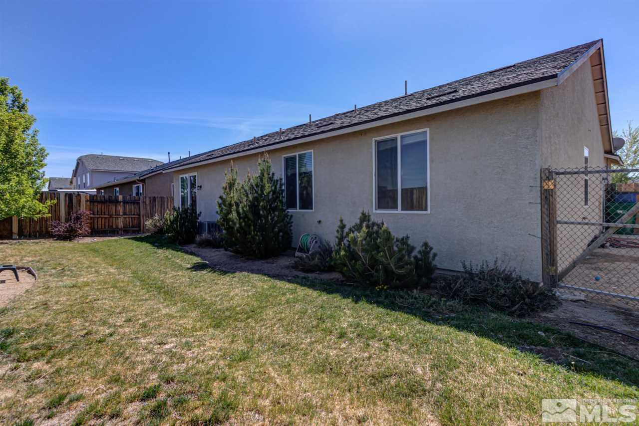 9045 Convair Way Reno, NV 89506 - Photo 32 of 34 a backyard of a house with lots of green space