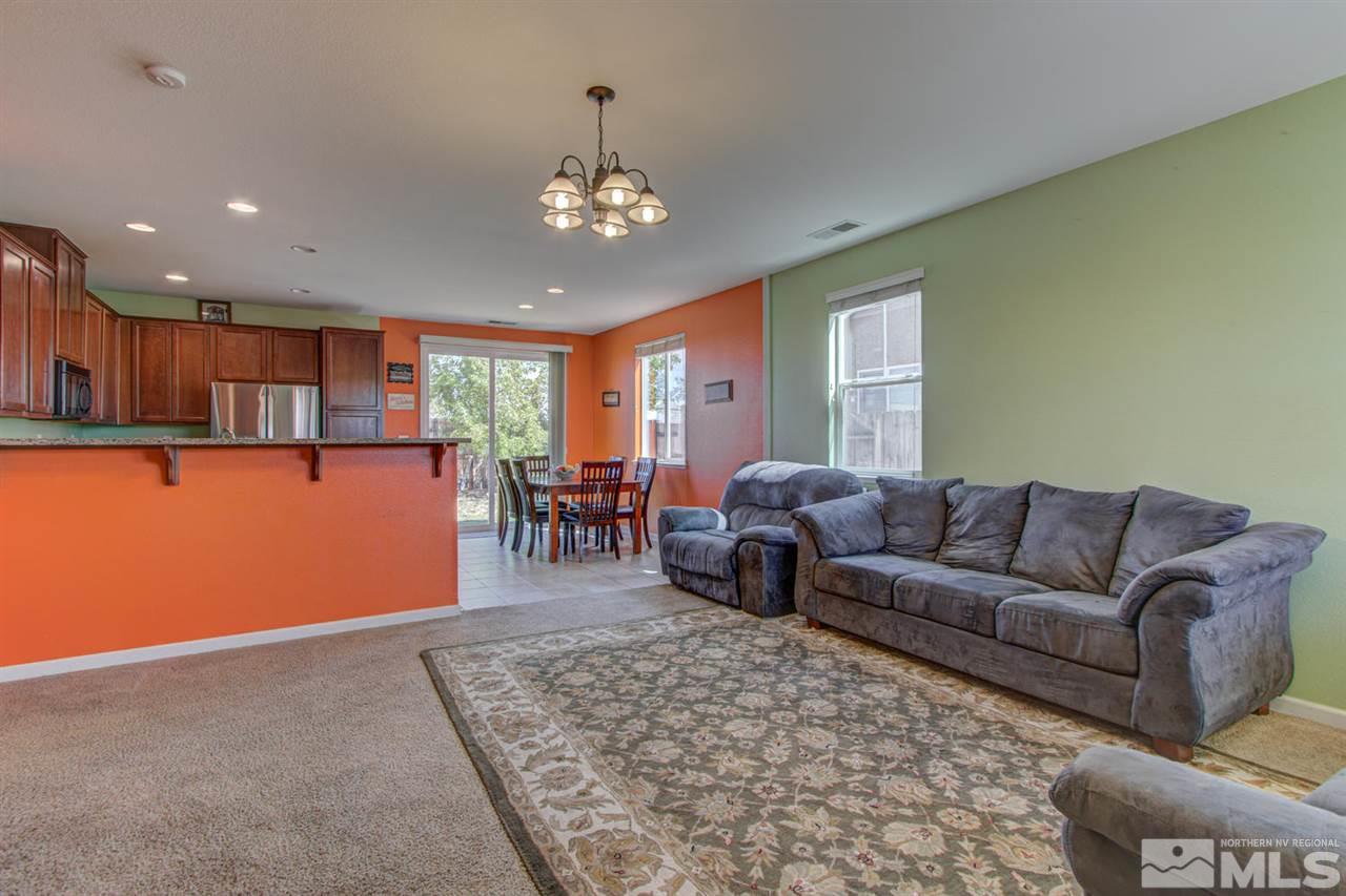 9045 Convair Way Reno, NV 89506 - Photo 4 of 34 a living room with furniture and a dining area