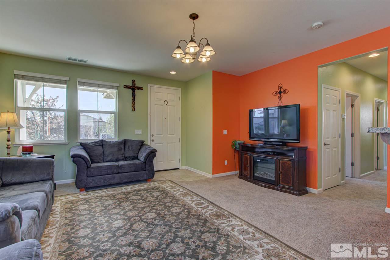 9045 Convair Way Reno, NV 89506 - Photo 6 of 34 a living room with furniture and a flat screen tv