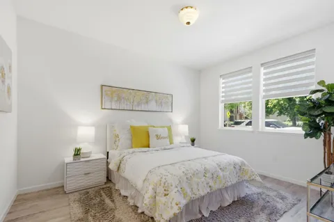 a bedroom with a bed and window