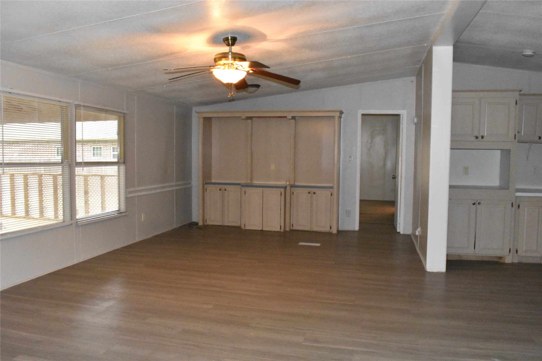 22536 Yancy Road Porter, TX 77365 - Photo 14 of 50 an empty room with chandelier fan and windows