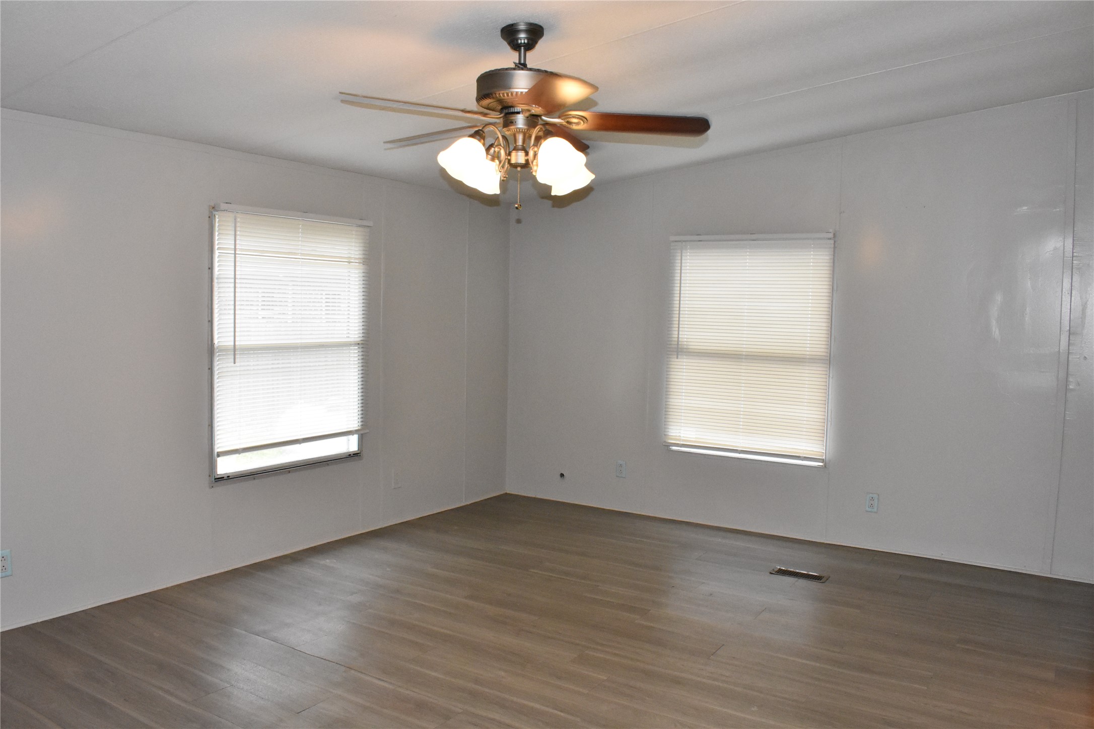 22536 Yancy Road Porter, TX 77365 - Photo 21 of 50 a view of an empty room with wooden floor and a window