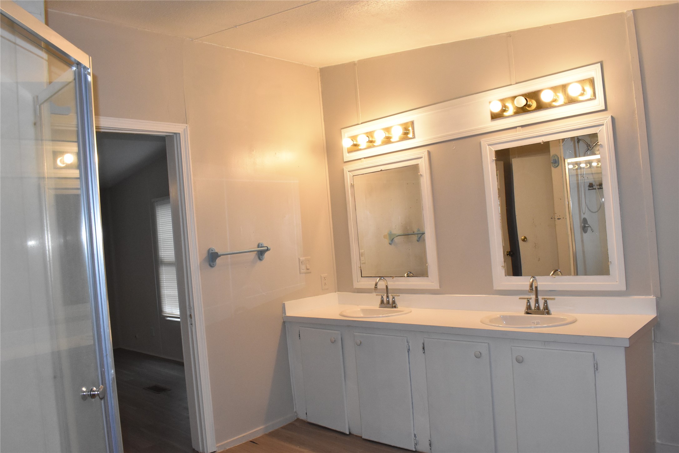 22536 Yancy Road Porter, TX 77365 - Photo 25 of 50 a bathroom with a double vanity sink and a mirror