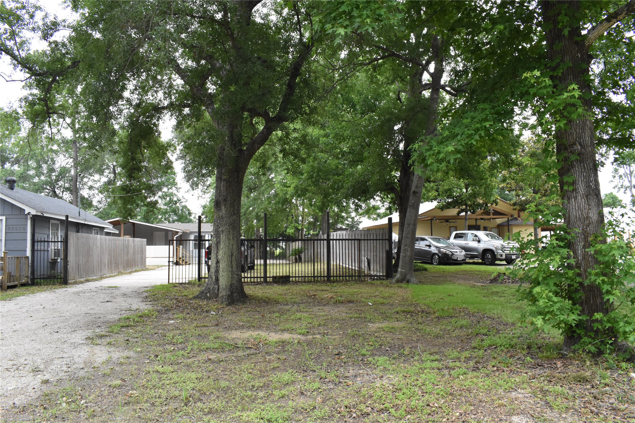 22536 Yancy Road Porter, TX 77365 - Photo 34 of 50 a backyard of a house with lots of green space