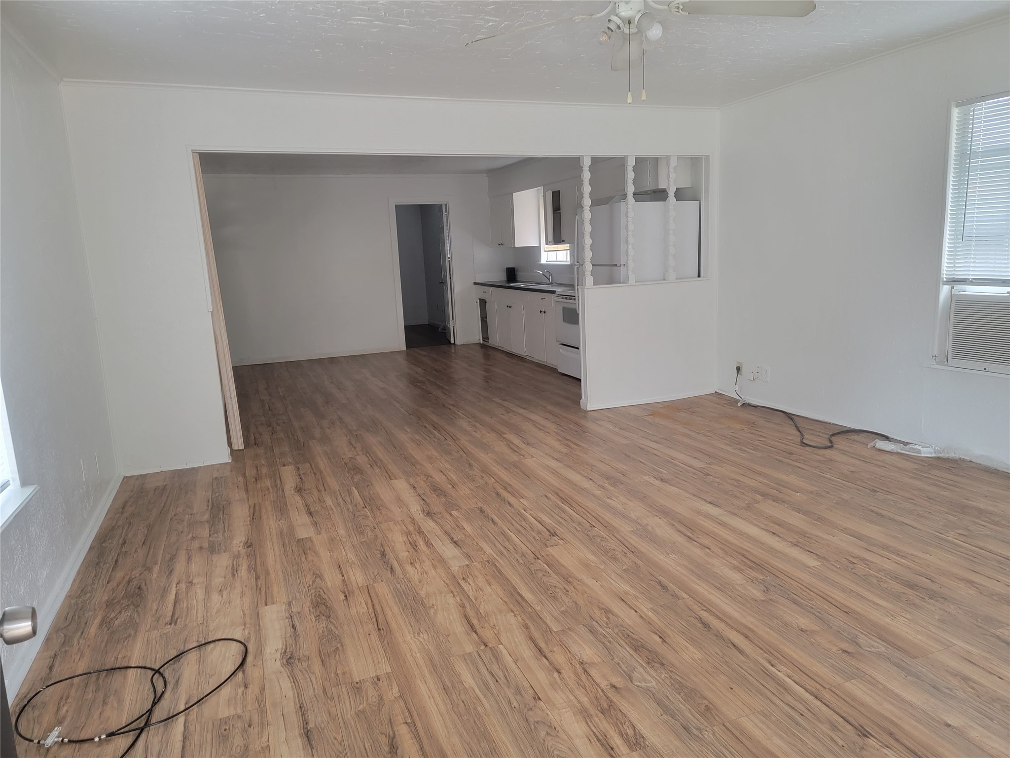 22536 Yancy Road Porter, TX 77365 - Photo 39 of 50 a view of a kitchen with wooden floor and a sink