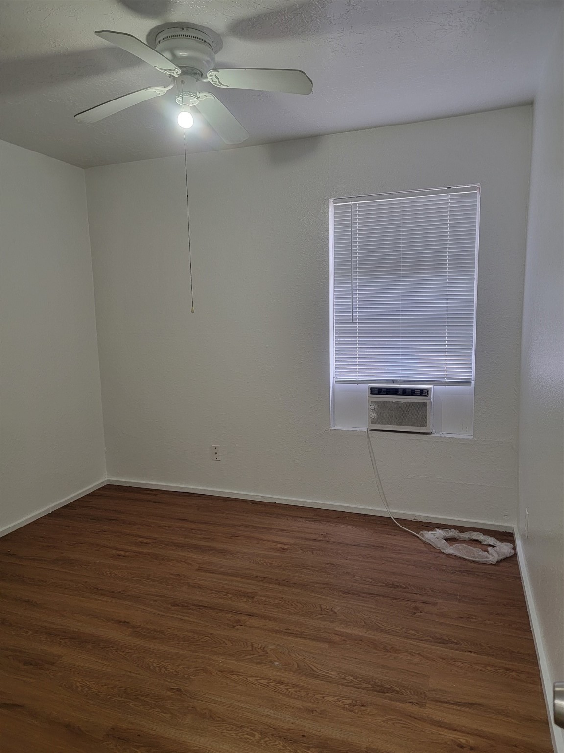 22536 Yancy Road Porter, TX 77365 - Photo 47 of 50 a view of an empty room with wooden floor and a window
