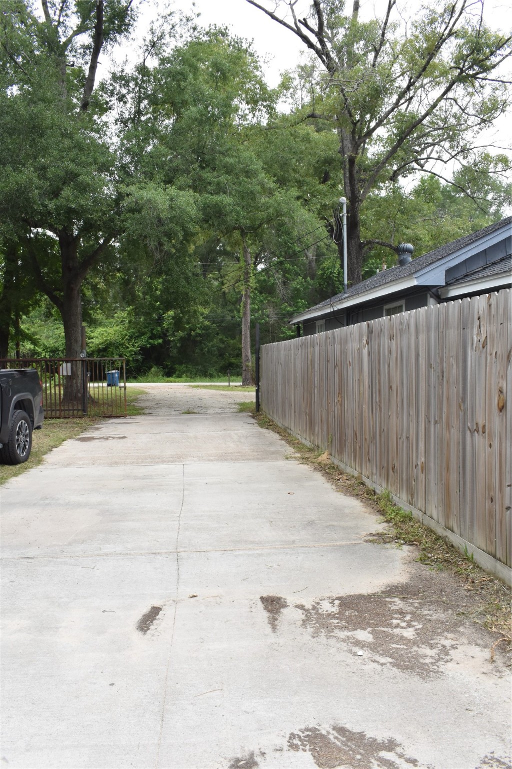 22536 Yancy Road Porter, TX 77365 - Photo 7 of 50 a backyard of a house with trees and outdoor space