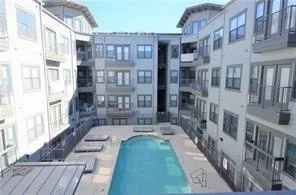 a backyard of a house with barbeque oven and outdoor seating