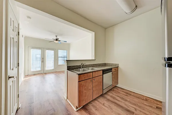 a view of a kitchen counter space with wooden floor