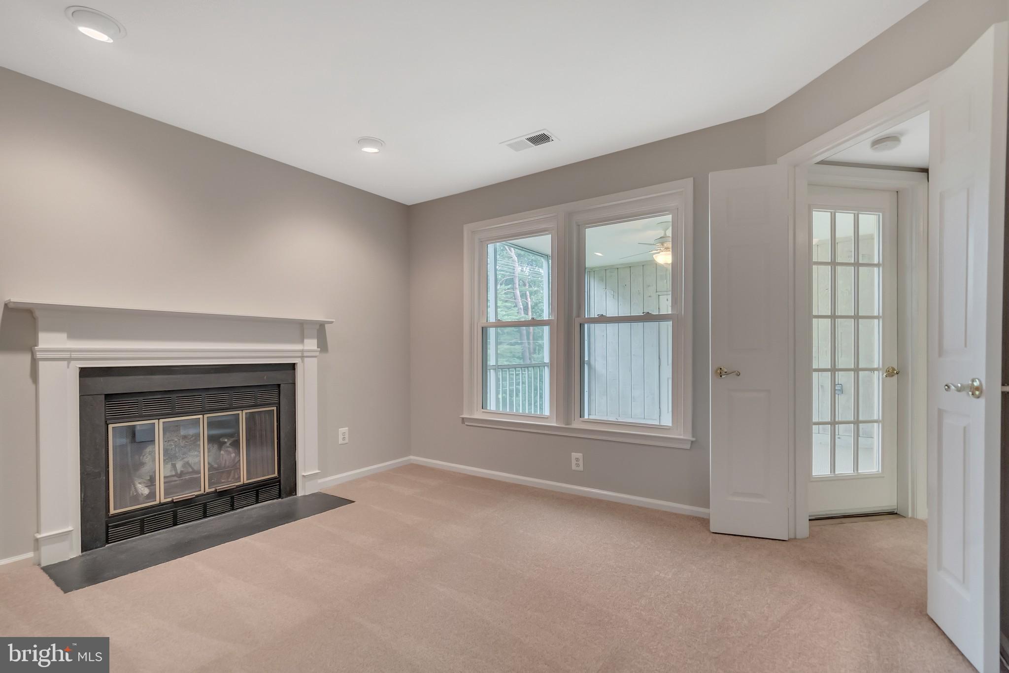 10717 Kings Riding Way, Unit 202 Rockville, MD 20852 - Photo 13 of 34 Cozy wood burning fireplace in the den