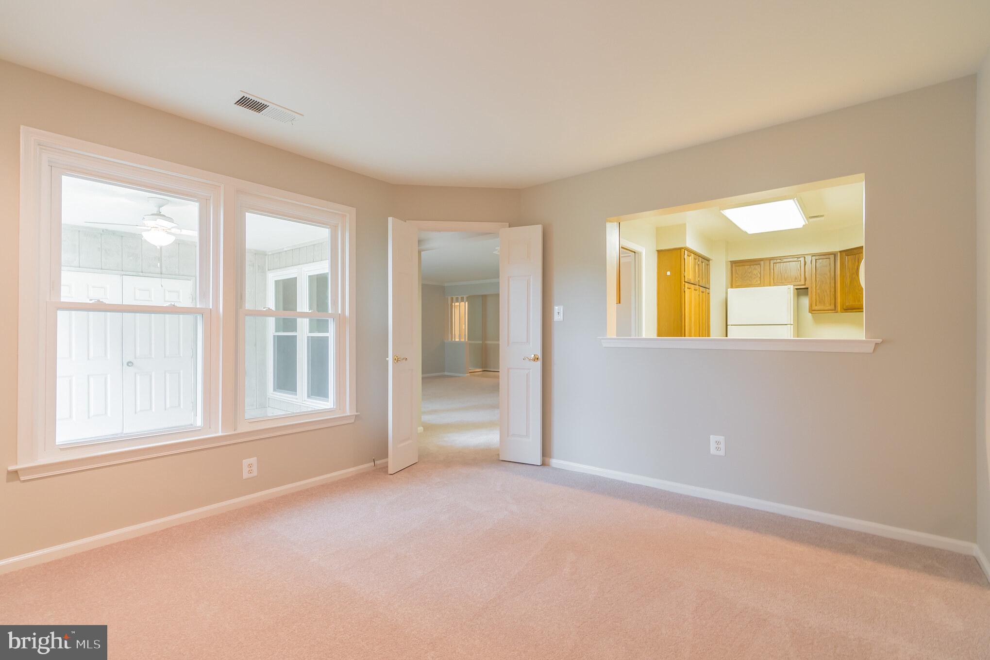 10717 Kings Riding Way, Unit 202 Rockville, MD 20852 - Photo 15 of 34 Den toward kitchen and porch